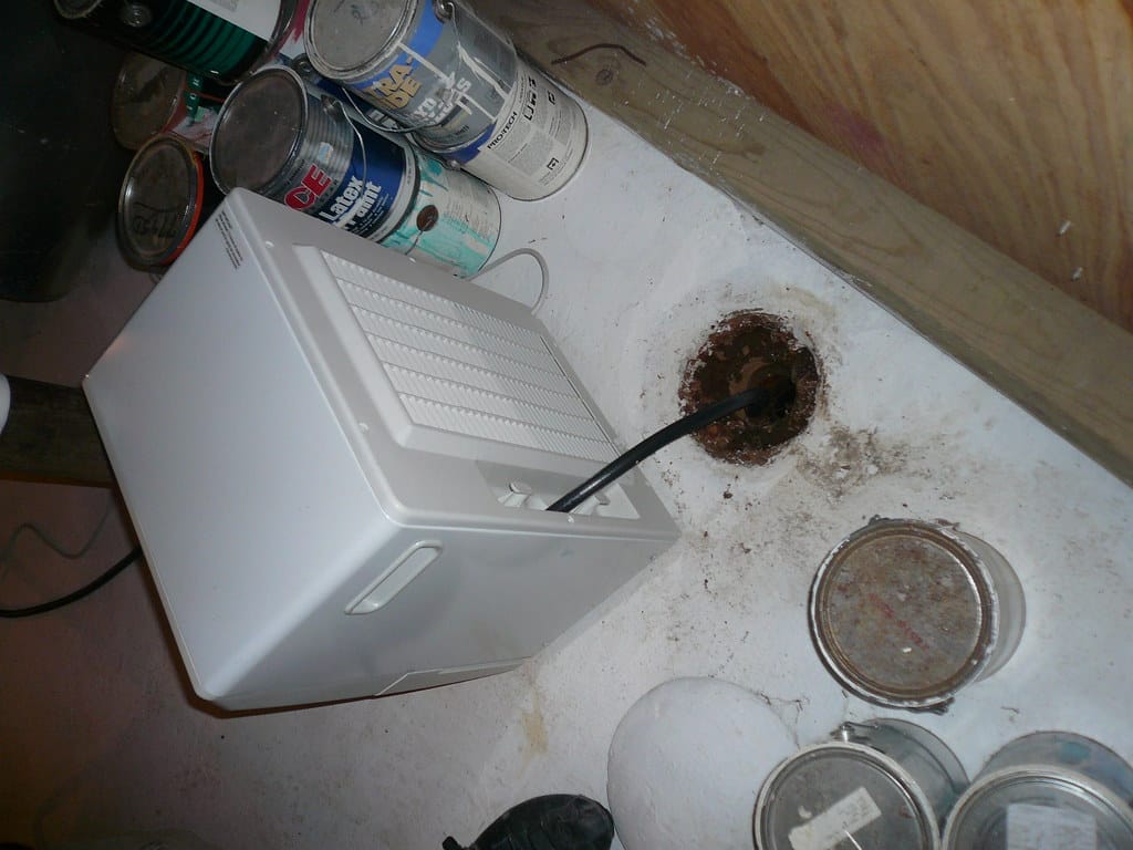 Illustrative example of a crawl space dehumidifier with a condensate pump