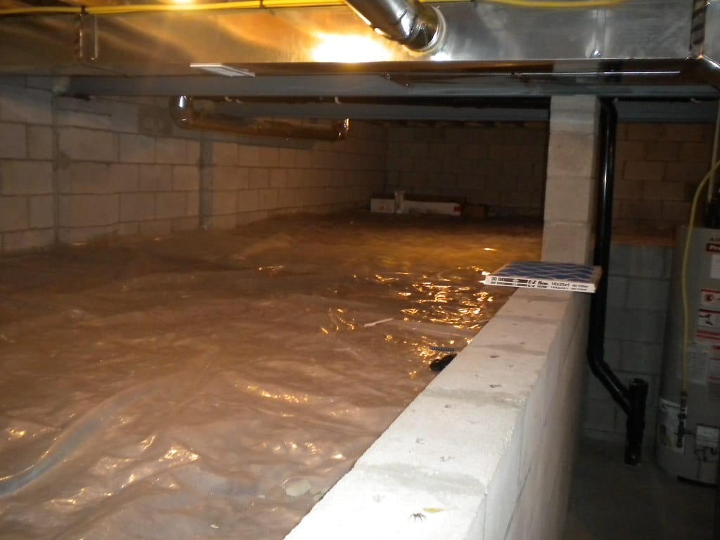 Illustrative example of a heavy-duty crawl space vapor barrier installation